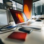 Photo folders open beside a backup drive