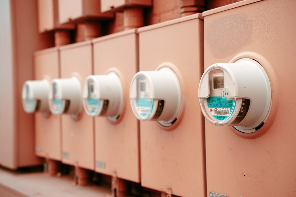 Digital meter display beside an electrical service cabinet