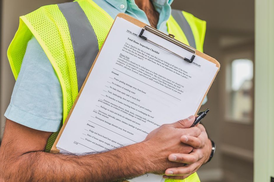 Engineer checking bridge inspection notes on a tablet