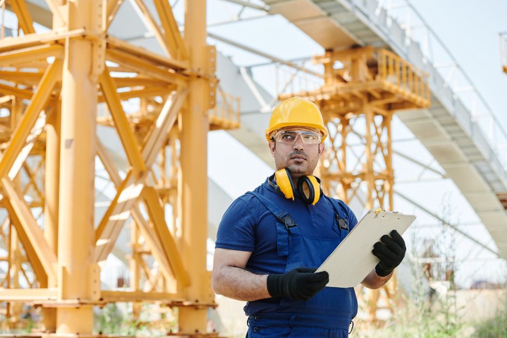 Engineer checking an inspection reference before sending a query