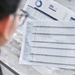 Research notes beside a comparison matrix