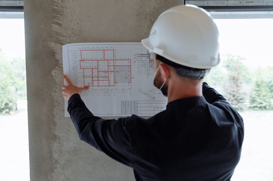 Inspection records arranged beside a draft topic plan