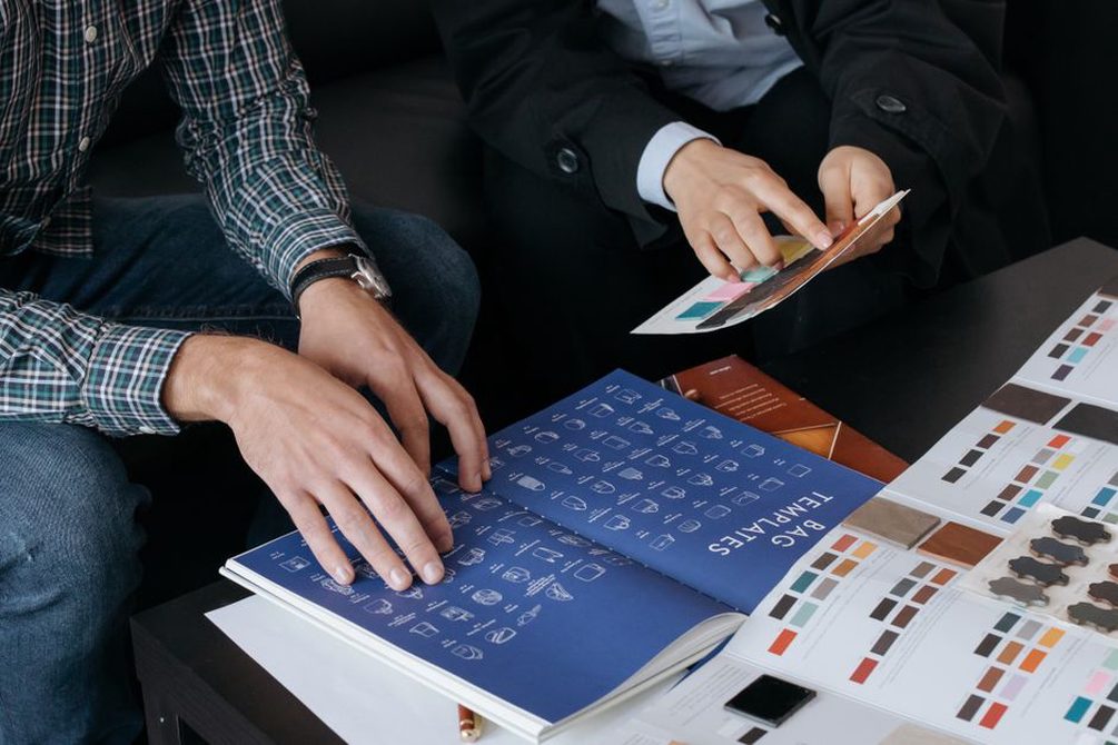 Type and colour samples arranged beside a page layout