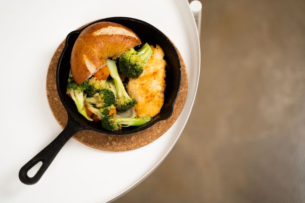 One-pan dinner ready beside a clear worktop