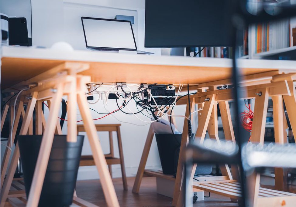 Clear work surface with cables kept away from chair wheels