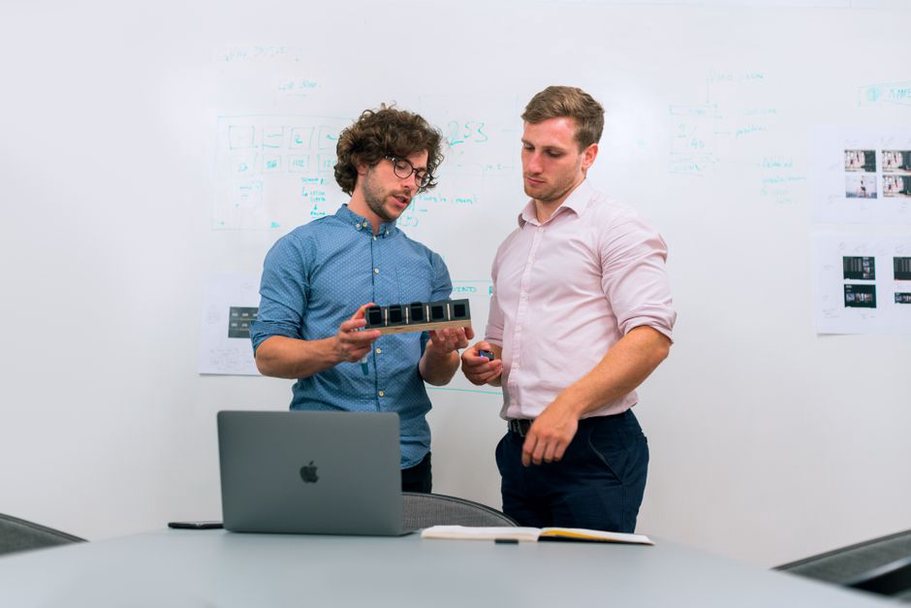 Engineers checking organizational details on a laptop