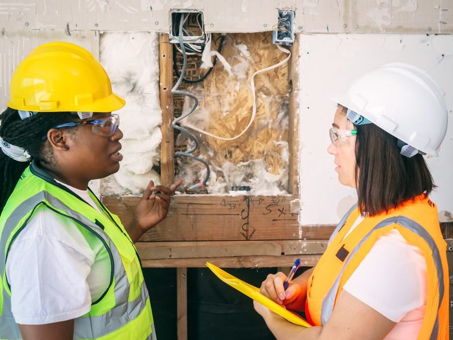 Inspectors compare field measurements during an infrastructure assessment