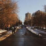 A person walking outside in morning daylight