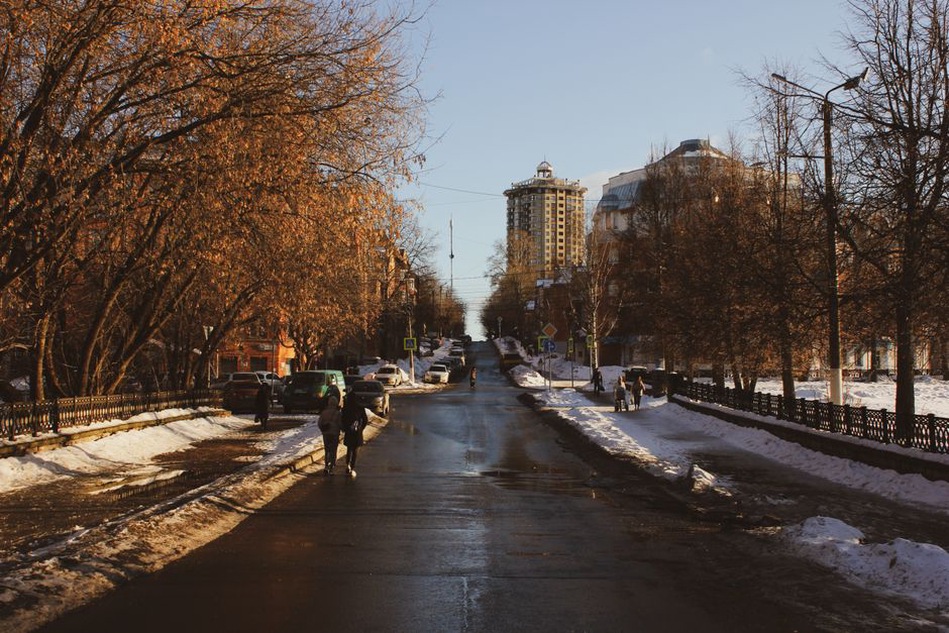 A person walking outside in morning daylight