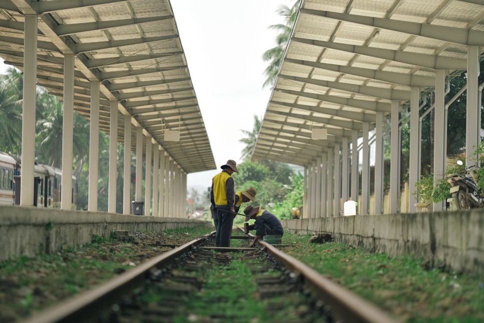 Survey equipment beside a monitored rail embankment