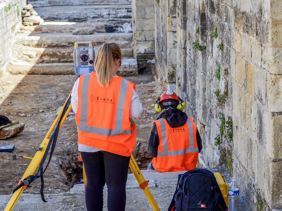Survey equipment beside an active rail embankment