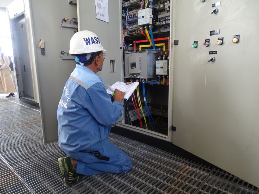 Technician verifies a trackside instrument after a data alert