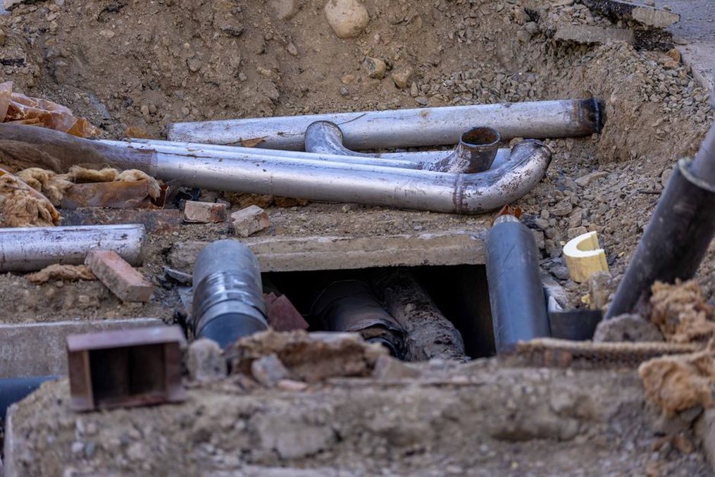 Perforated pipe set below the pavement base