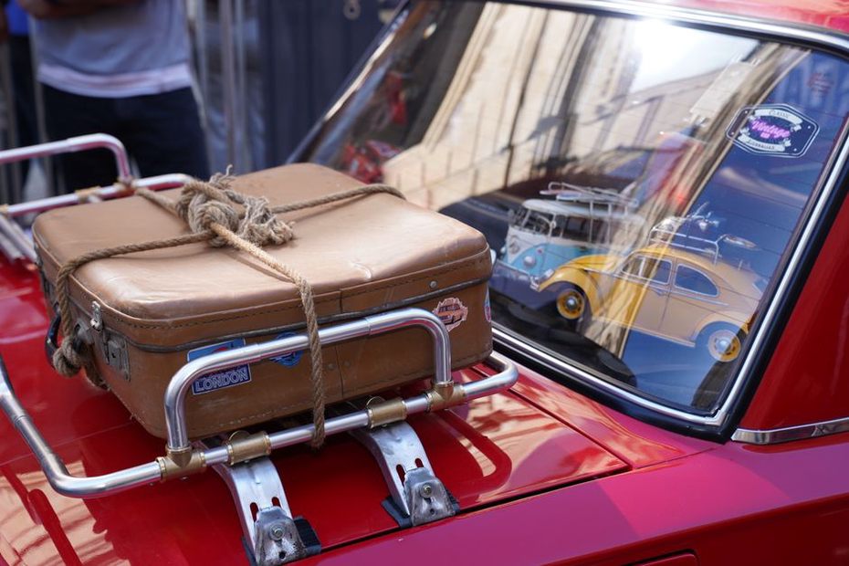 Heavy bags sit low in a packed trunk