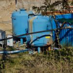 Treatment tanks beside an active tunnel worksite
