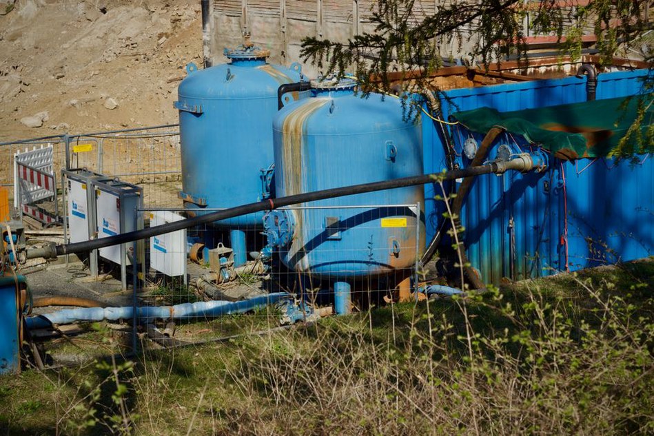Treatment tanks beside an active tunnel worksite