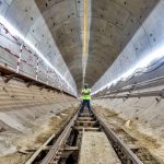 Inspection of a tunnel drain beside the track